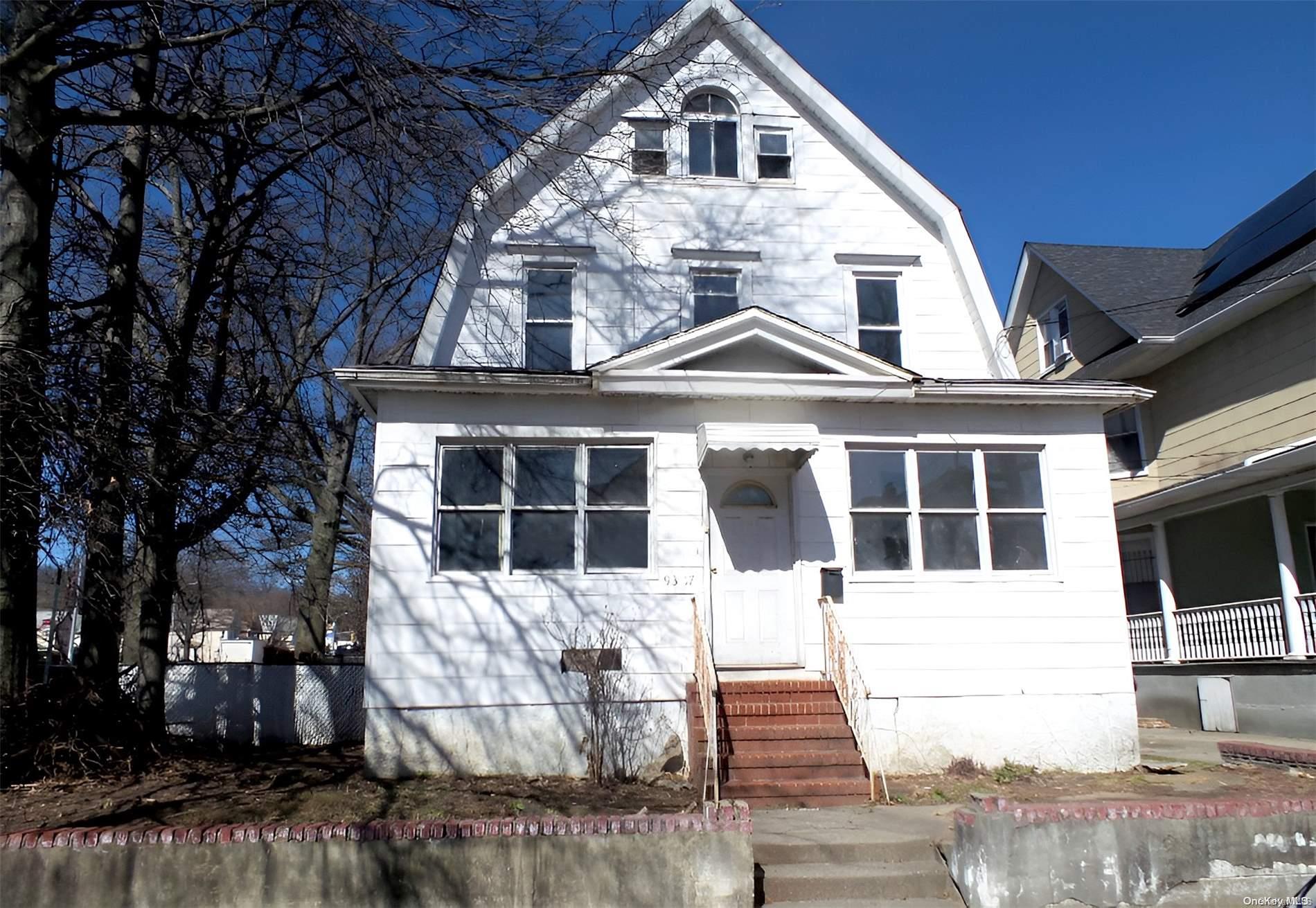 93-17 86th Road Queens, NY 11421 - Photo 1 of 1 a front view of a house with a yard