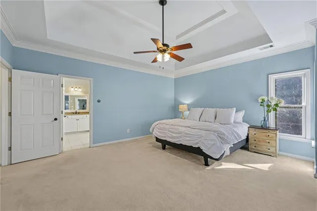 a living room with furniture and a dresser