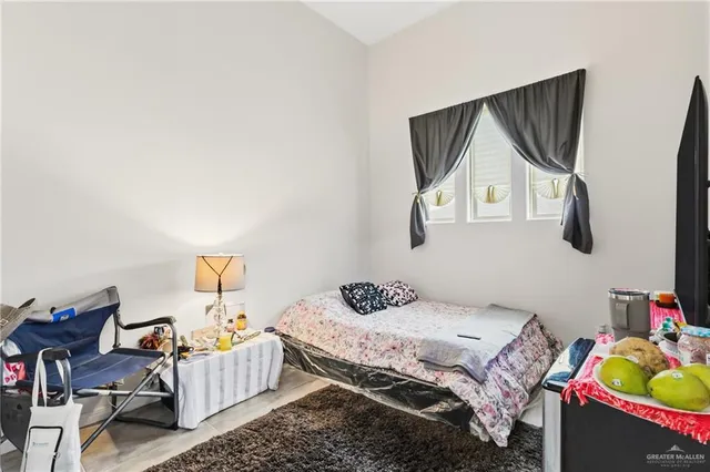 a bedroom with a bed and dresser