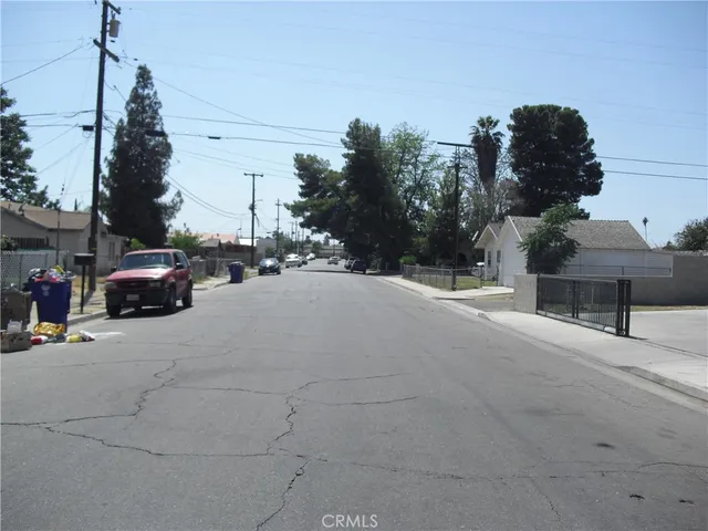 a view of street with parked cars