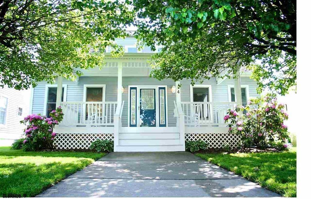 4 Walnut Road Ocean City, NJ 08226 - Photo 1 of 1 a front view of a house with a garden