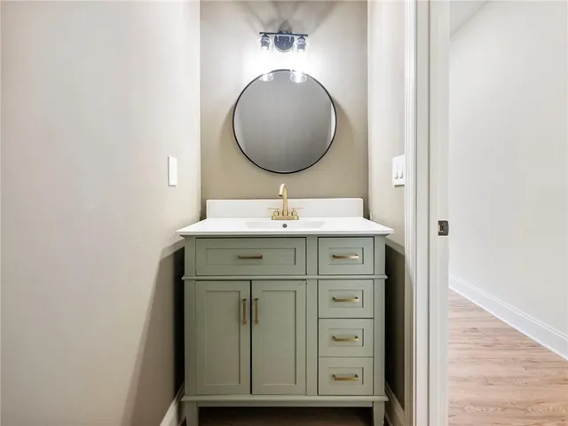 a view of a hallway with white walls