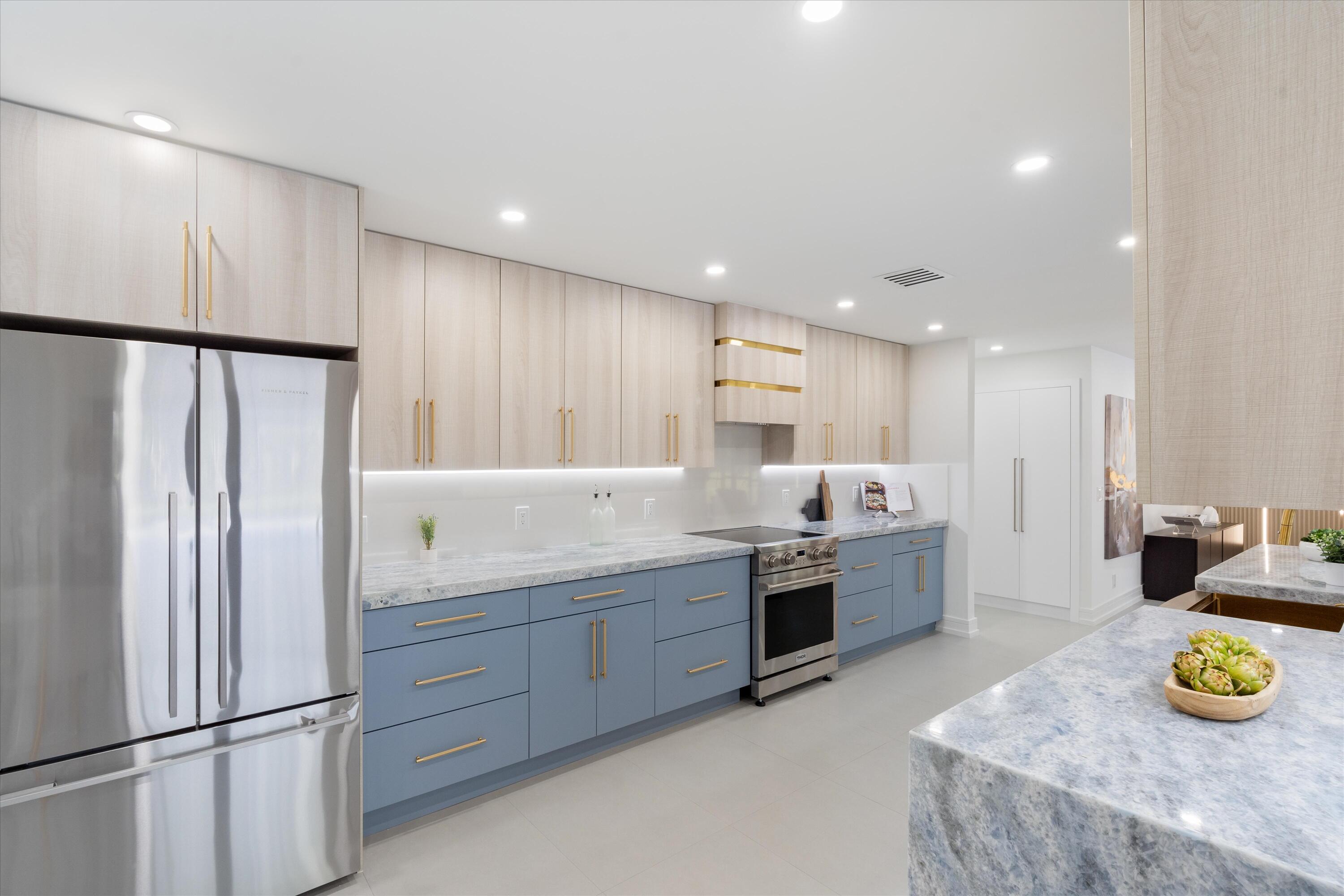 21766 Beachnut Drive Boca Raton, FL 33433 - Photo 13 of 64 a kitchen with a refrigerator and microwave