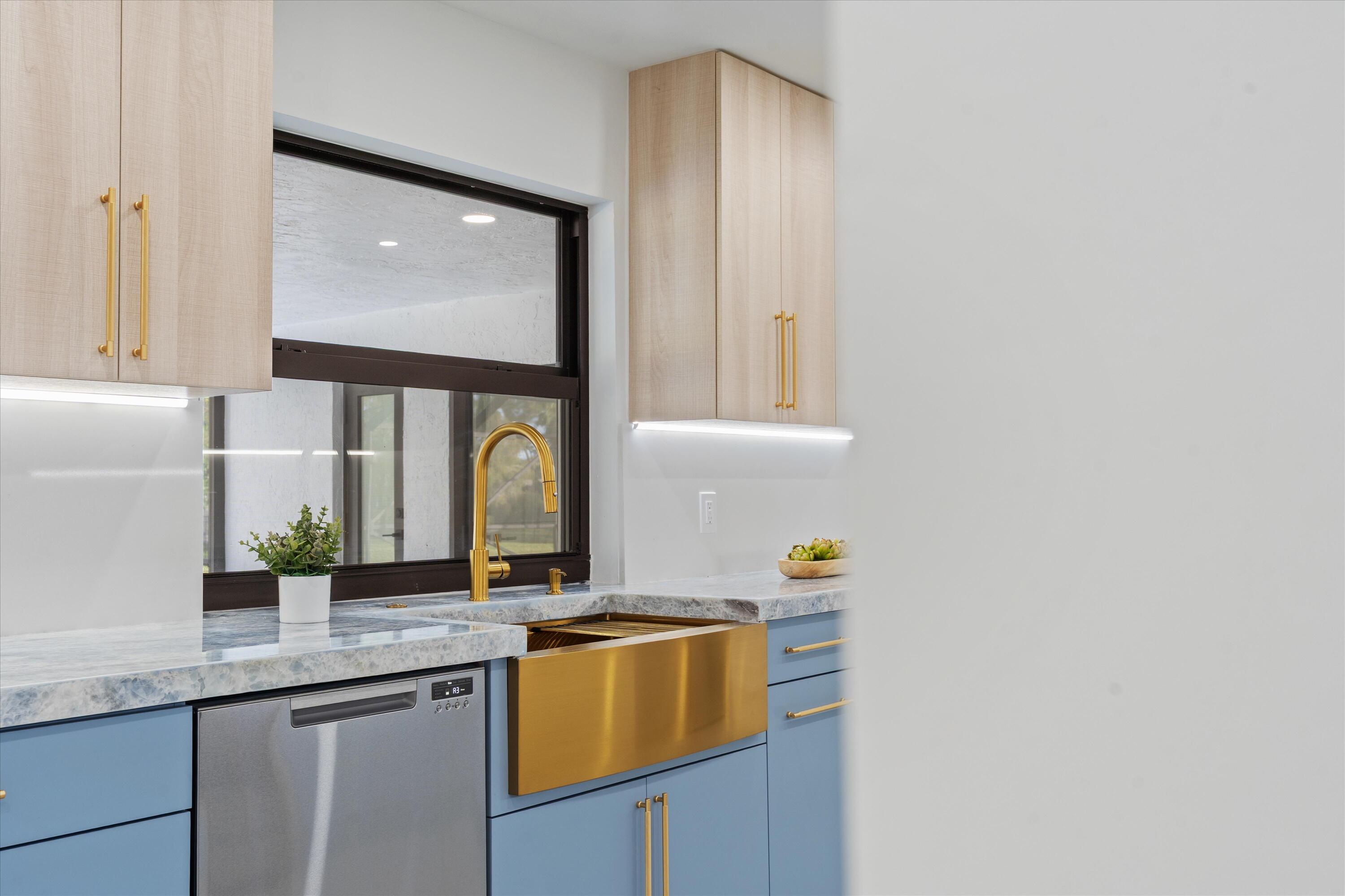 21766 Beachnut Drive Boca Raton, FL 33433 - Photo 14 of 64 a kitchen with granite countertop white cabinets and window