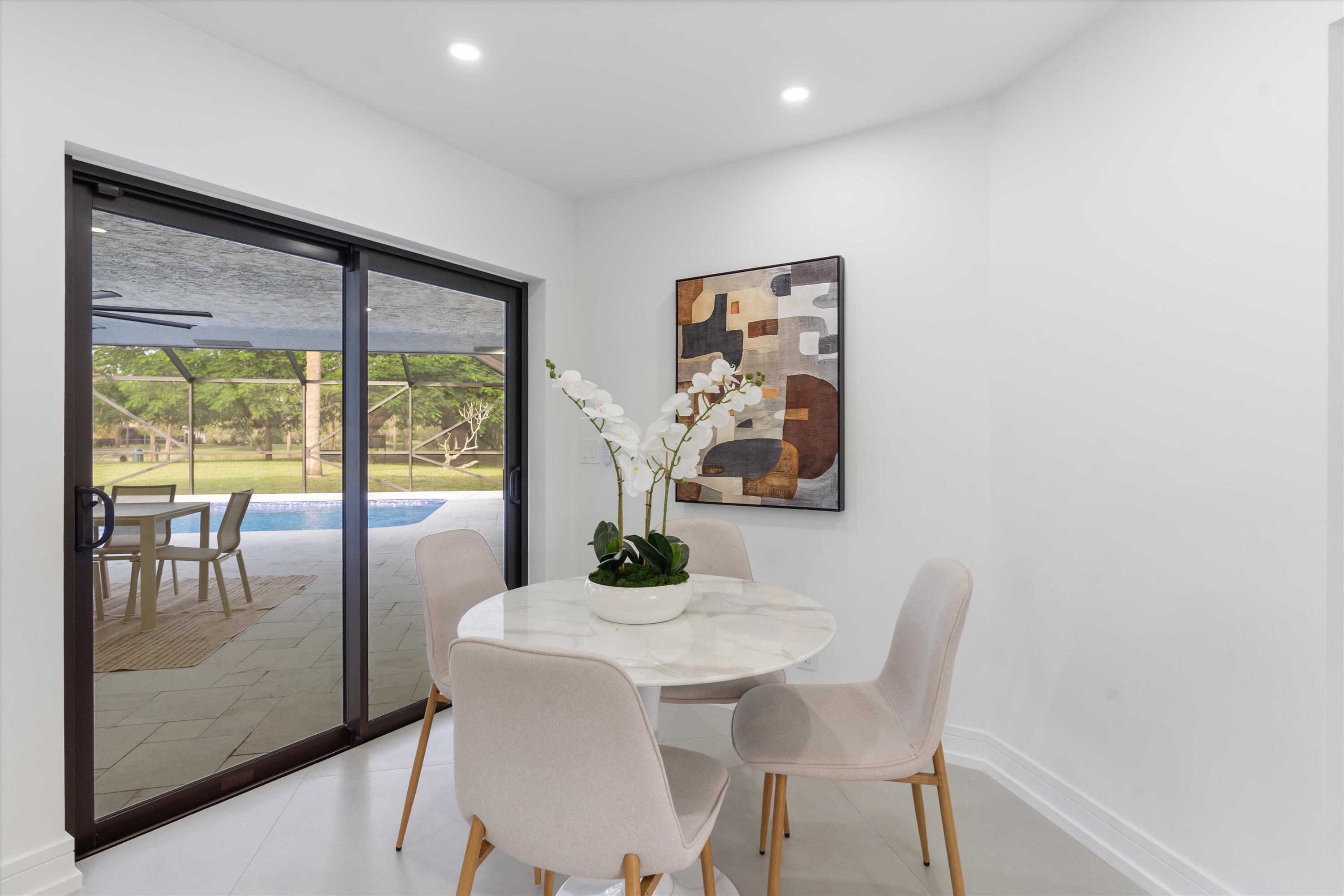 21766 Beachnut Drive Boca Raton, FL 33433 - Photo 20 of 64 a dining room with furniture and window