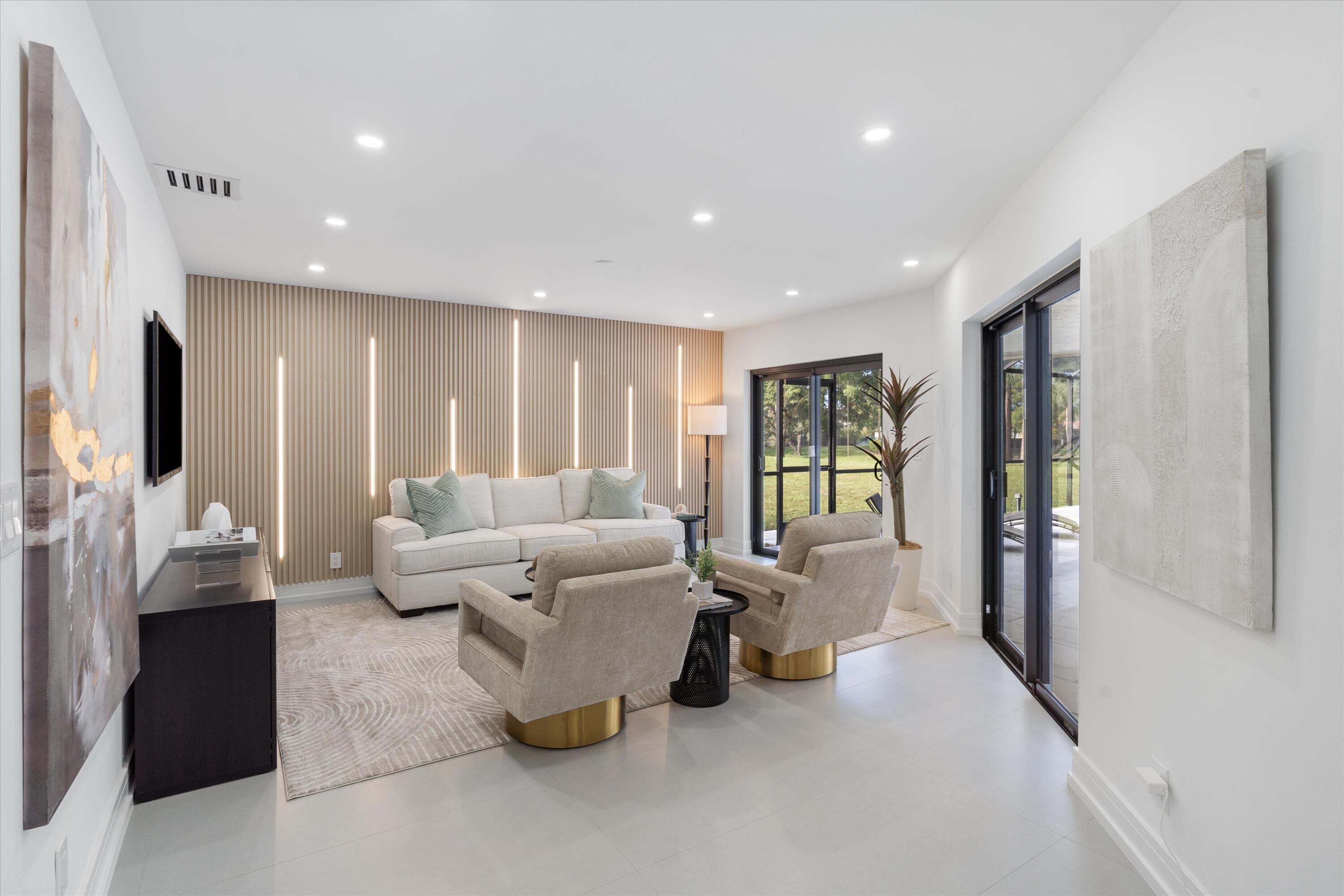21766 Beachnut Drive Boca Raton, FL 33433 - Photo 21 of 64 a living room with furniture and a flat screen tv
