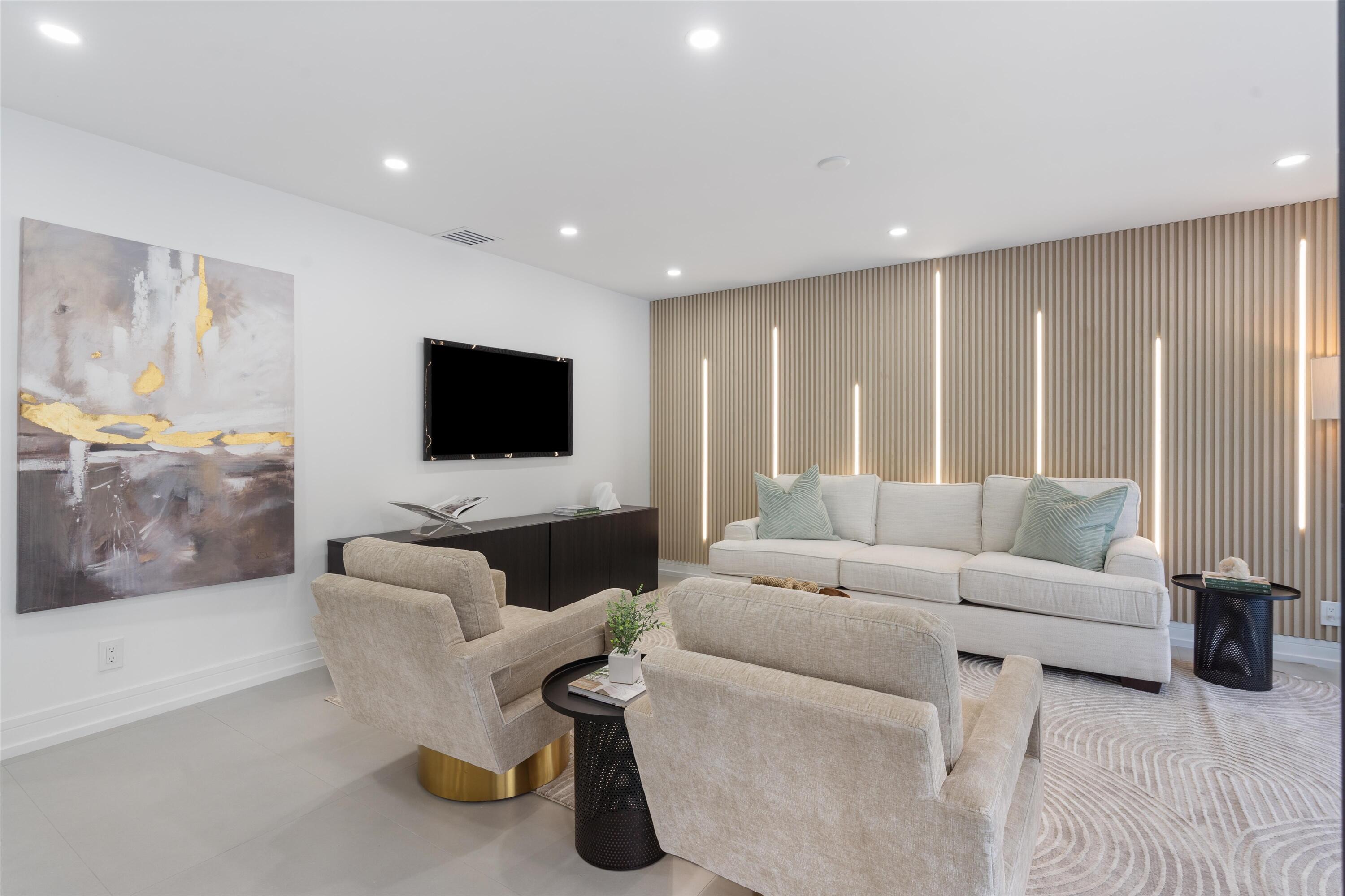 21766 Beachnut Drive Boca Raton, FL 33433 - Photo 22 of 64 a living room with furniture and a flat screen tv