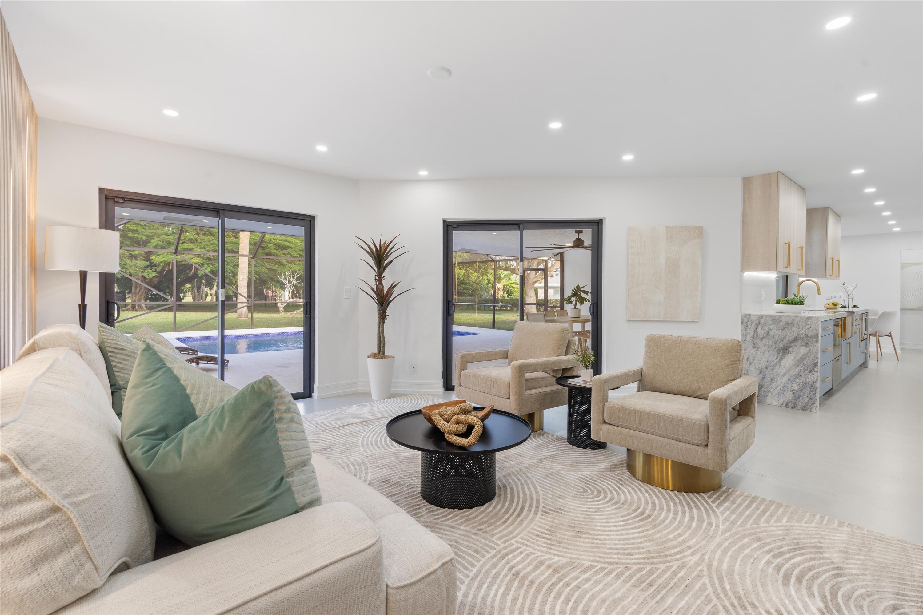 21766 Beachnut Drive Boca Raton, FL 33433 - Photo 25 of 64 a living room with furniture and a large window