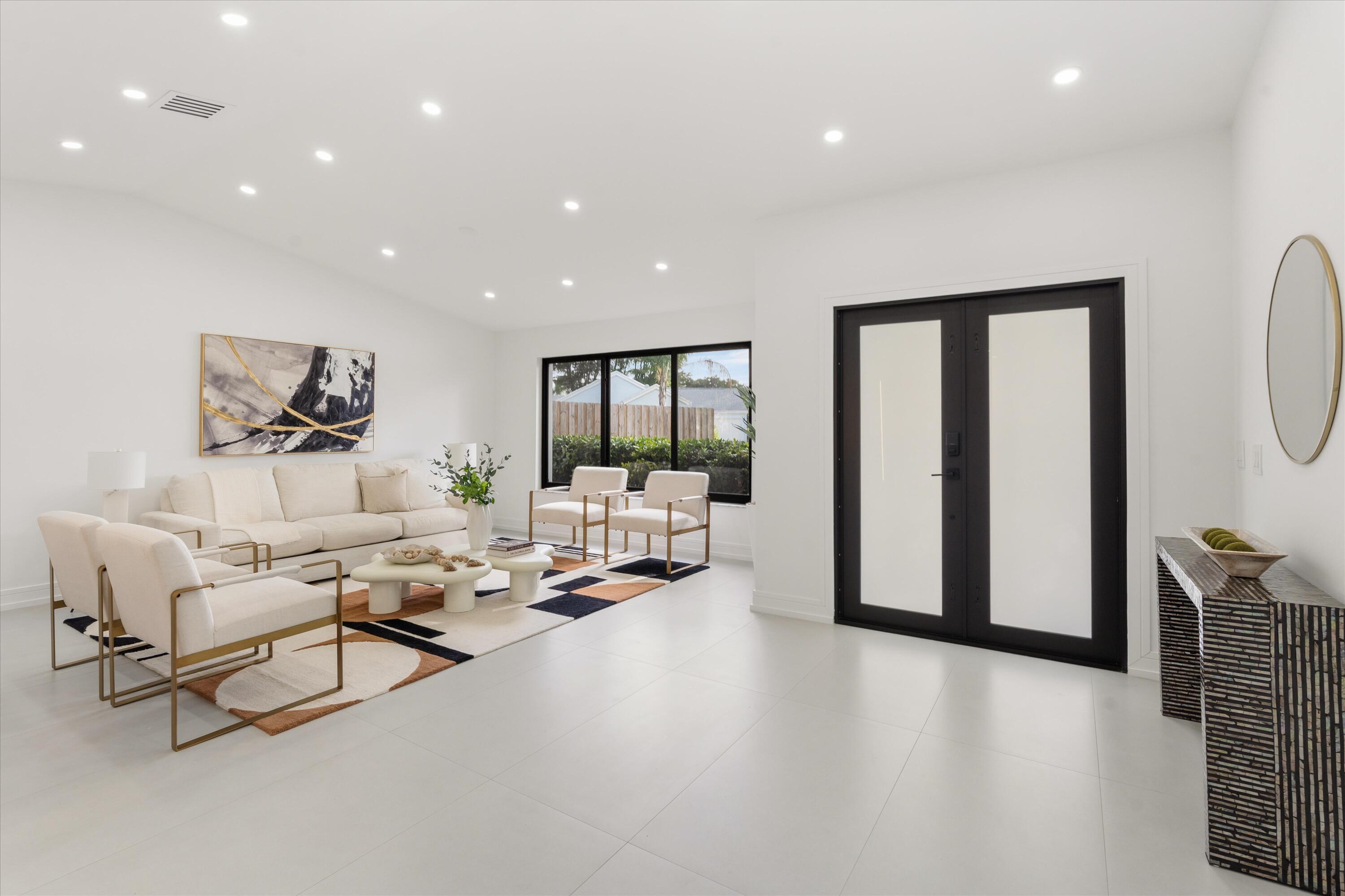 21766 Beachnut Drive Boca Raton, FL 33433 - Photo 3 of 64 a living room with furniture and a large window
