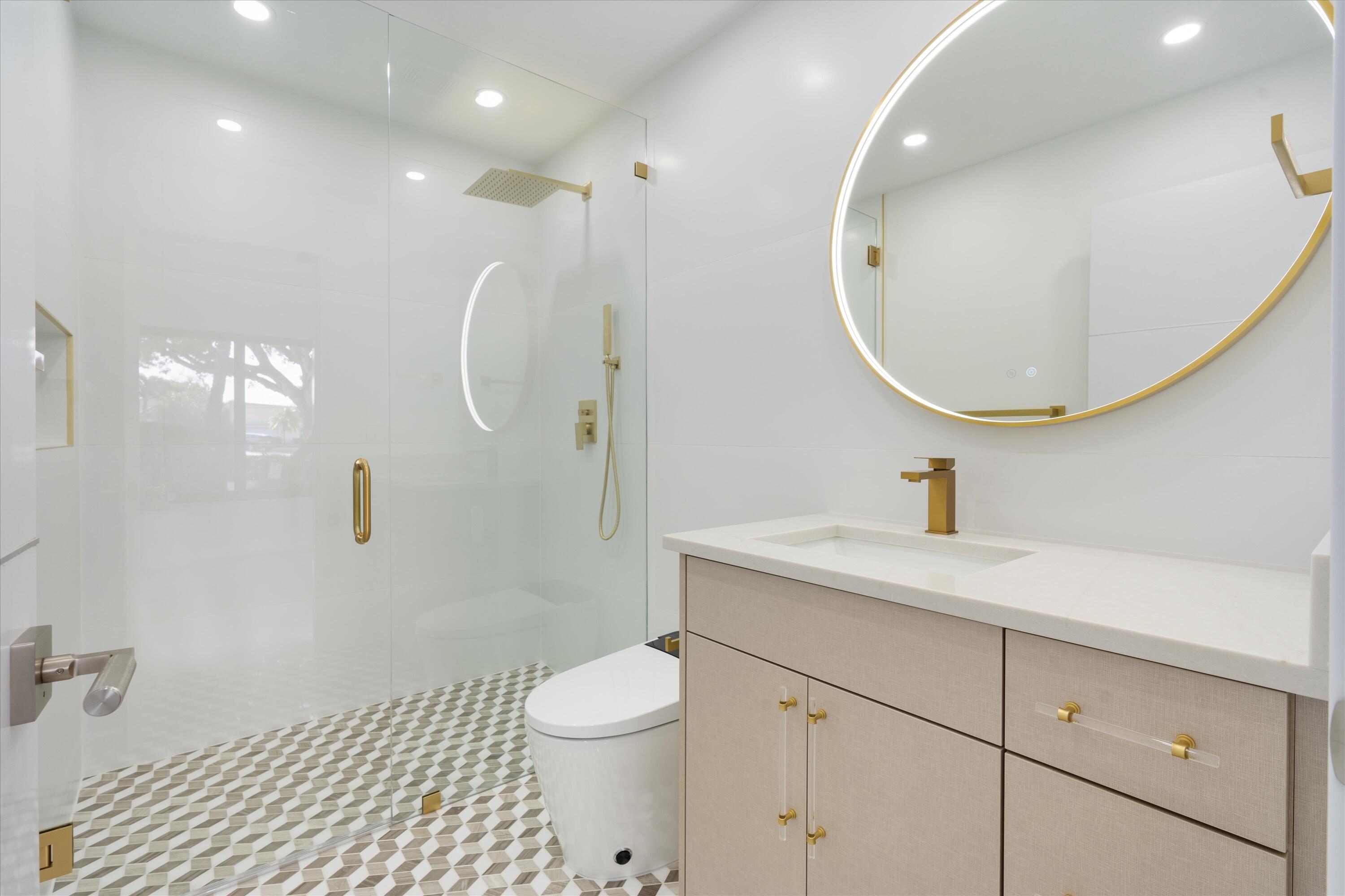 21766 Beachnut Drive Boca Raton, FL 33433 - Photo 41 of 64 a bathroom with a sink a toilet and a mirror