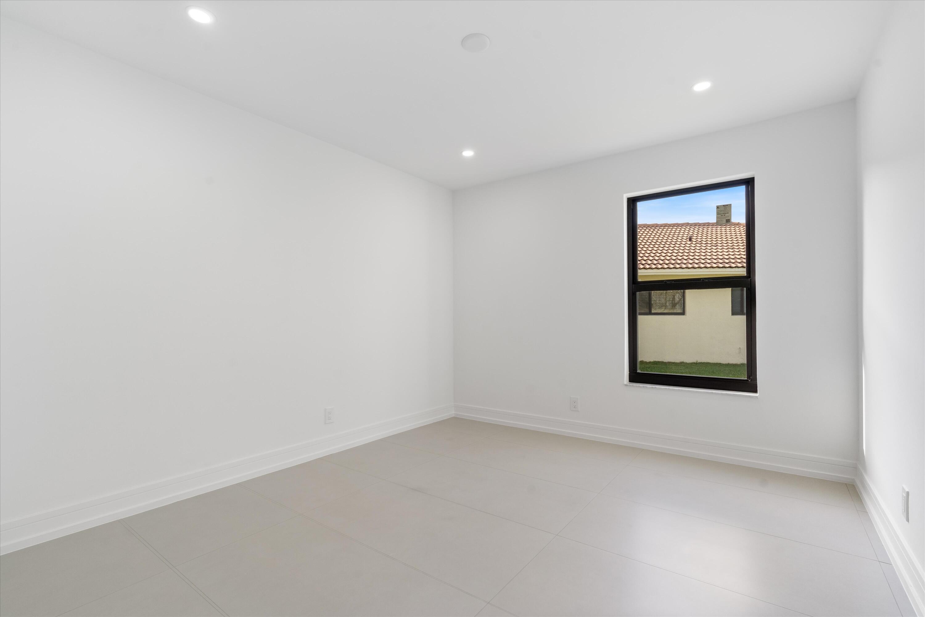 21766 Beachnut Drive Boca Raton, FL 33433 - Photo 45 of 64 an empty room with a window