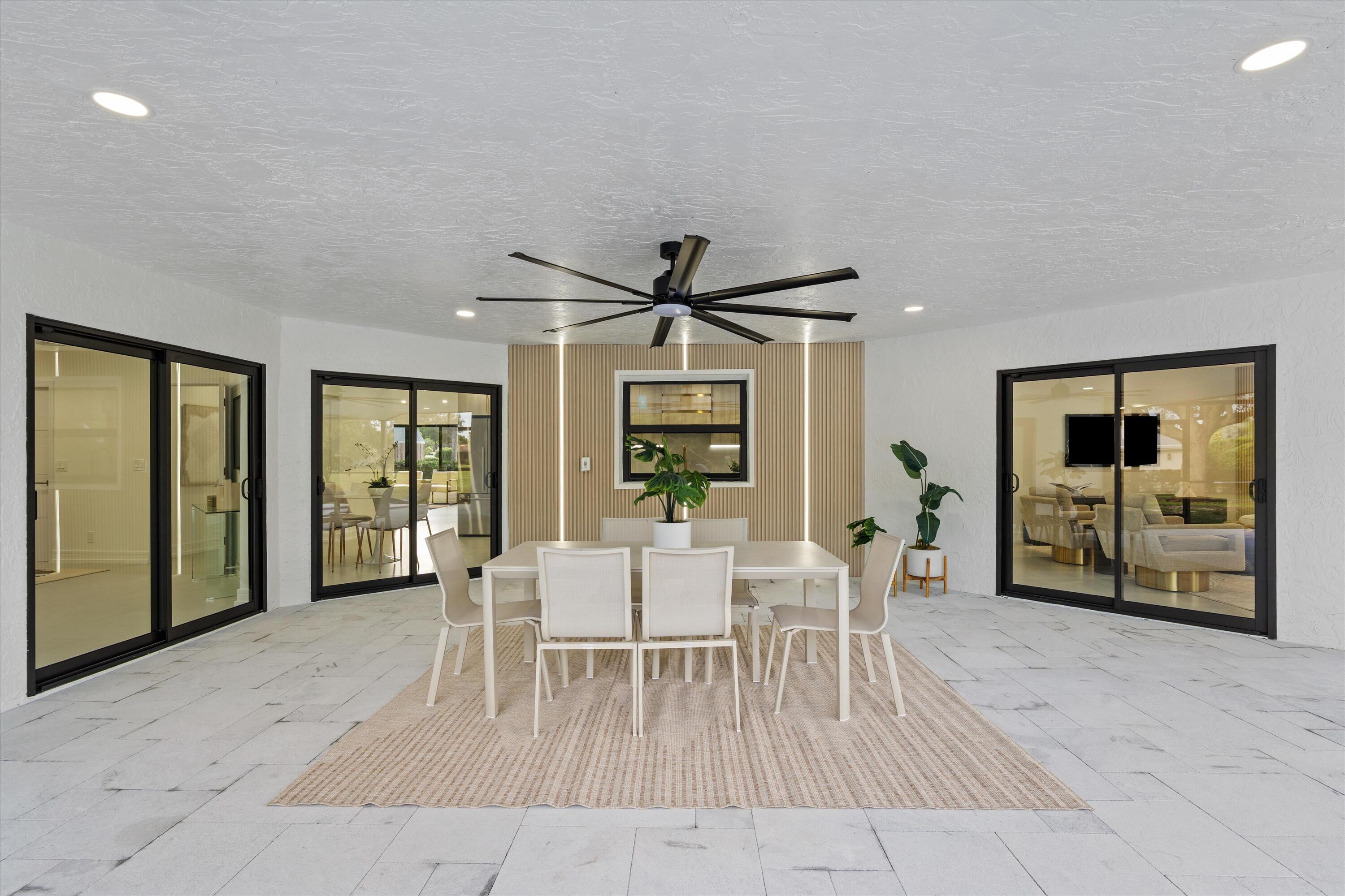 21766 Beachnut Drive Boca Raton, FL 33433 - Photo 52 of 64 a living room with furniture a window and a flat screen tv