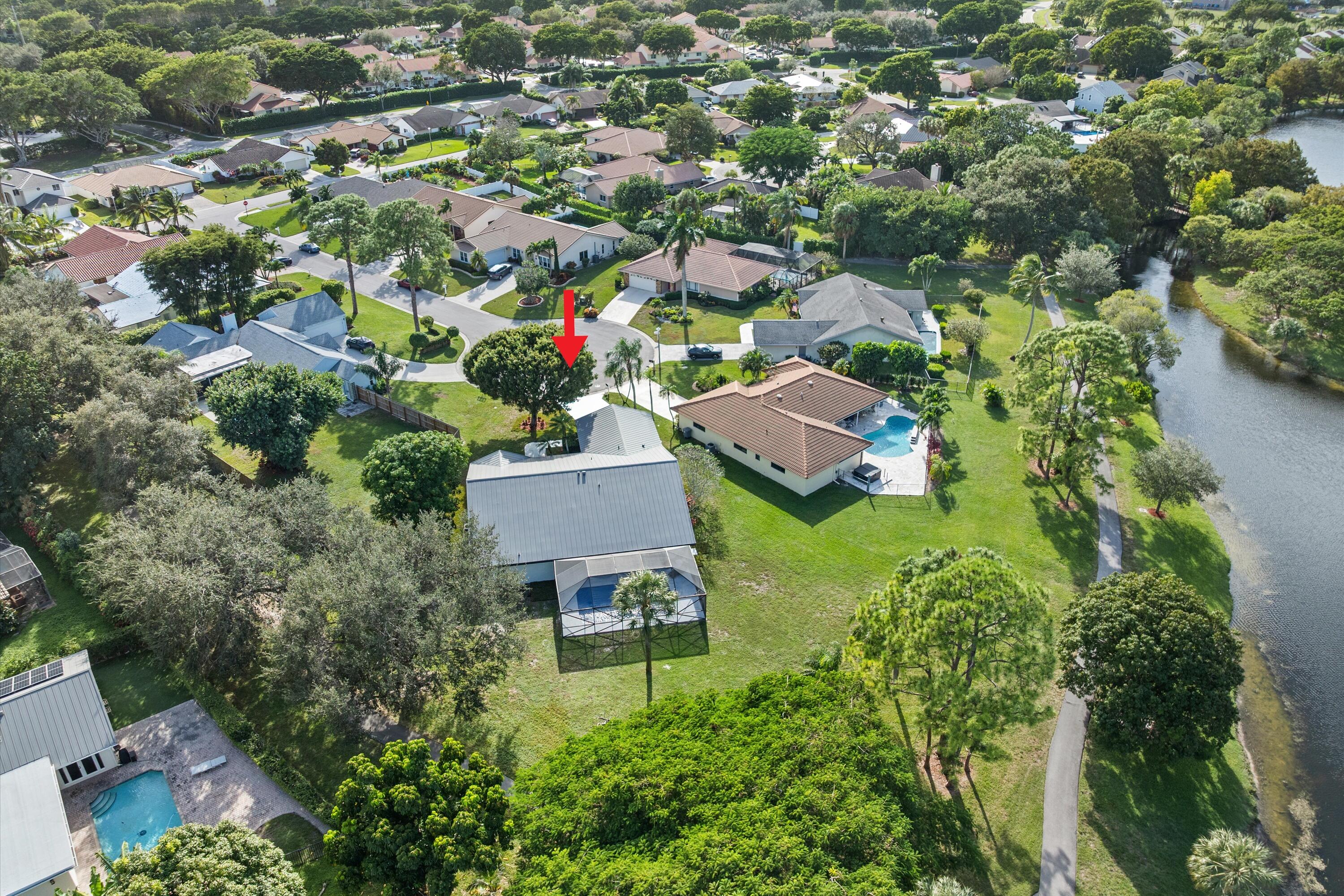 21766 Beachnut Drive Boca Raton, FL 33433 - Photo 61 of 64 an aerial view of residential houses with outdoor space and trees