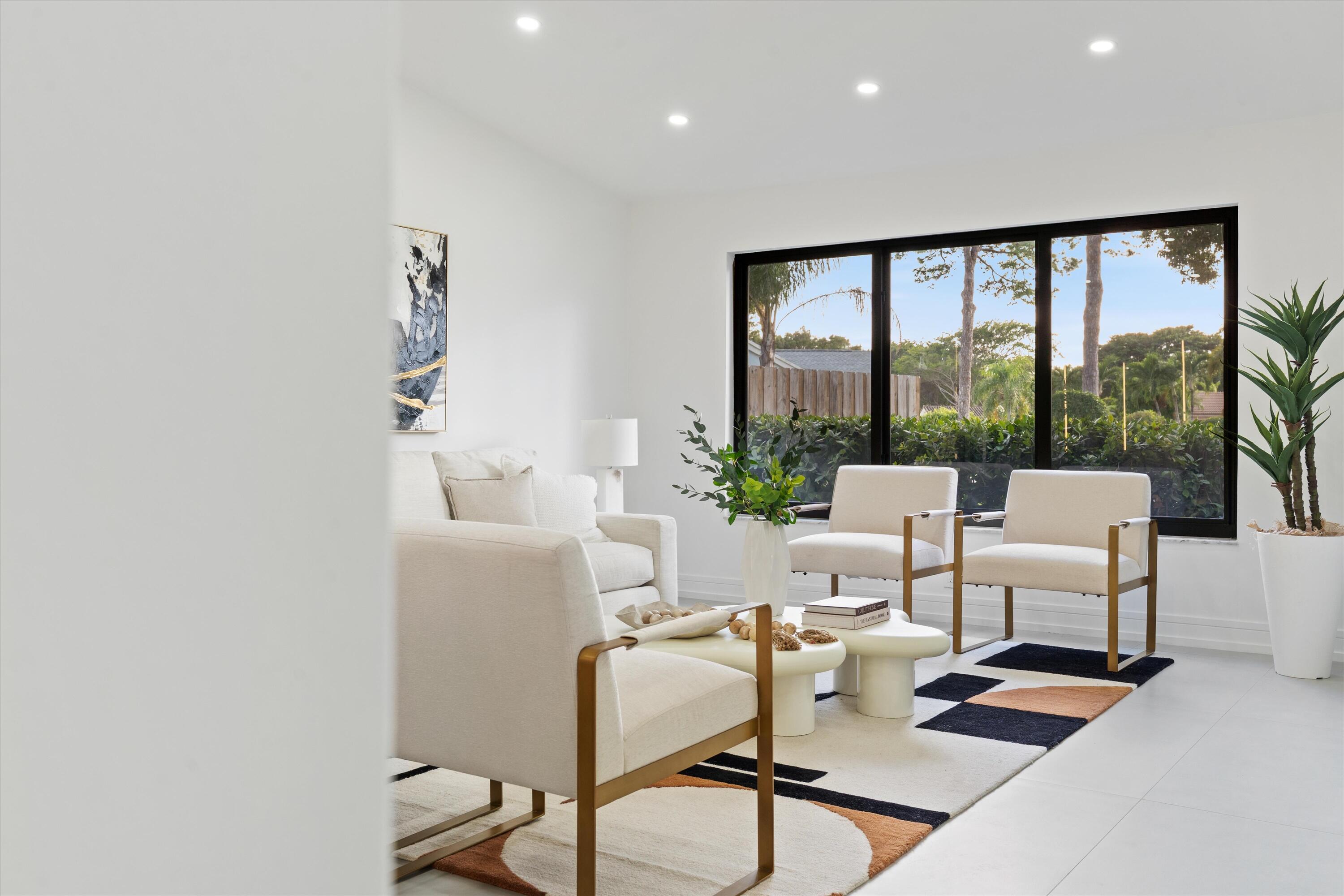 21766 Beachnut Drive Boca Raton, FL 33433 - Photo 8 of 64 a living room with furniture and a large window