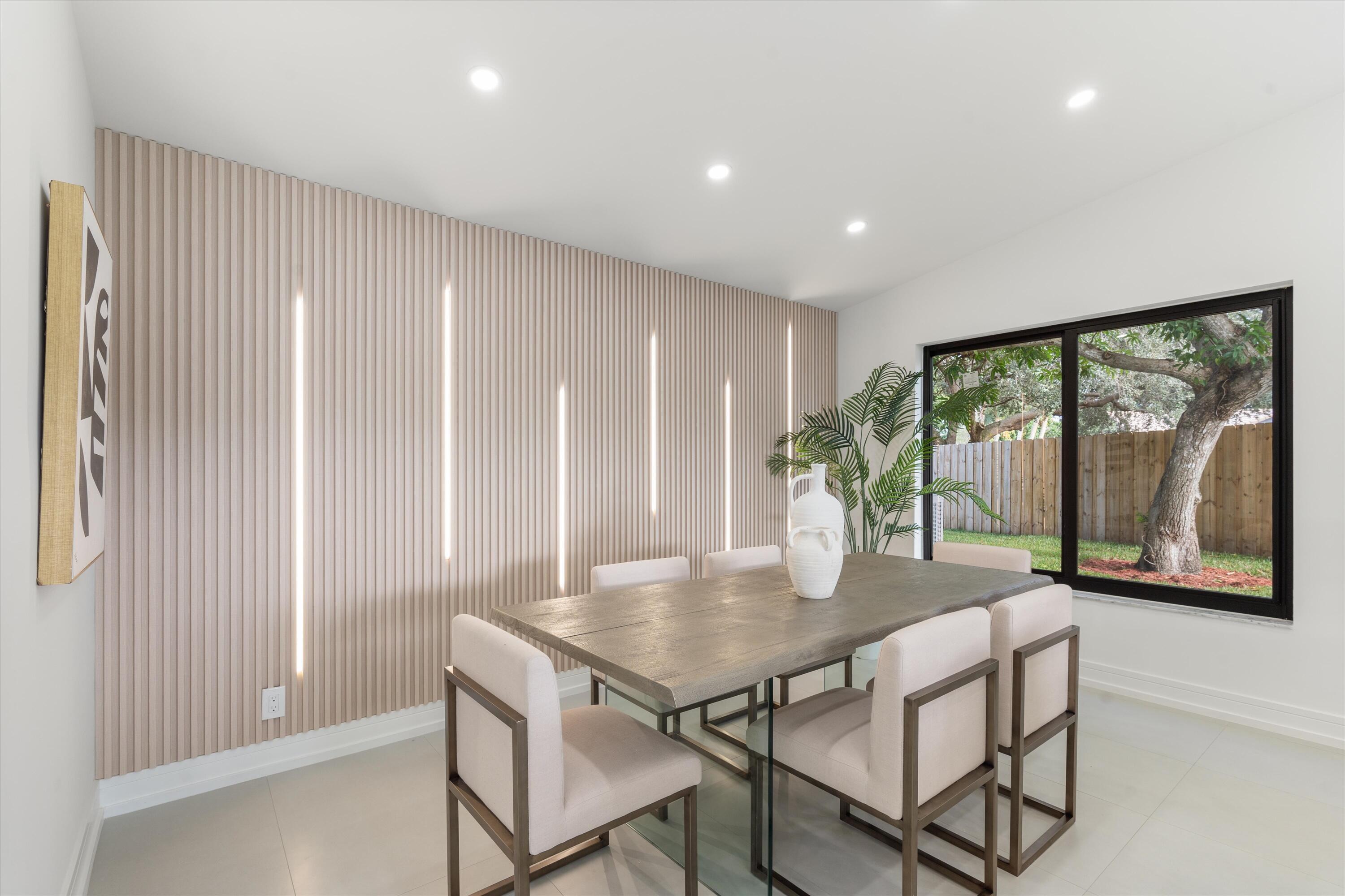 21766 Beachnut Drive Boca Raton, FL 33433 - Photo 10 of 64 a dining room with furniture and wooden floor