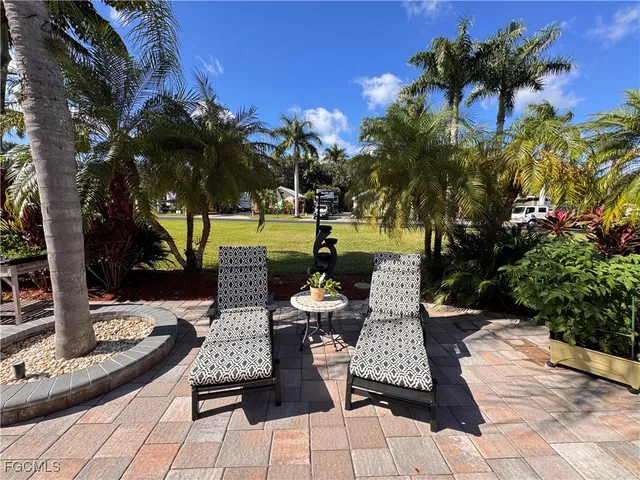 a view of a livingroom with furniture wooden floor and window