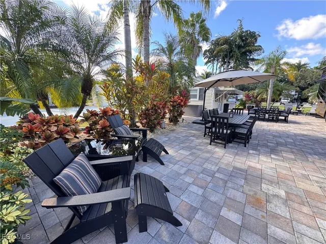a view of a chairs and tables in the patio