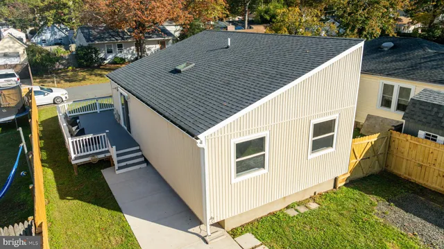 a view of house with backyard