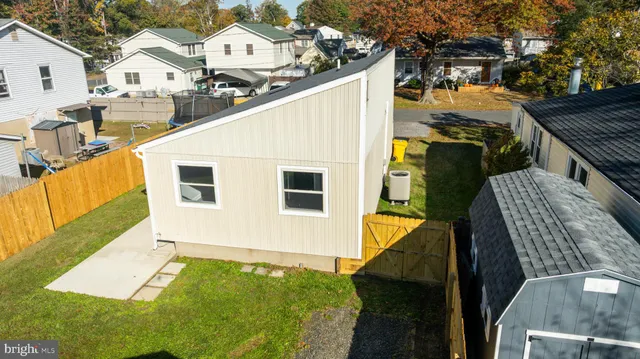 a view of a deck with barbeque grill and wooden fence