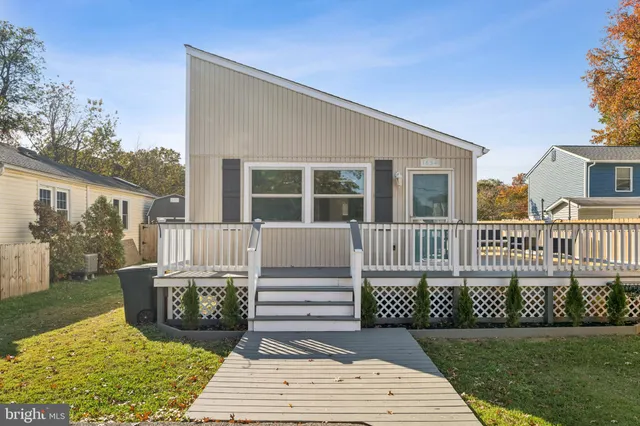 a view of swimming pool with a patio and a yard