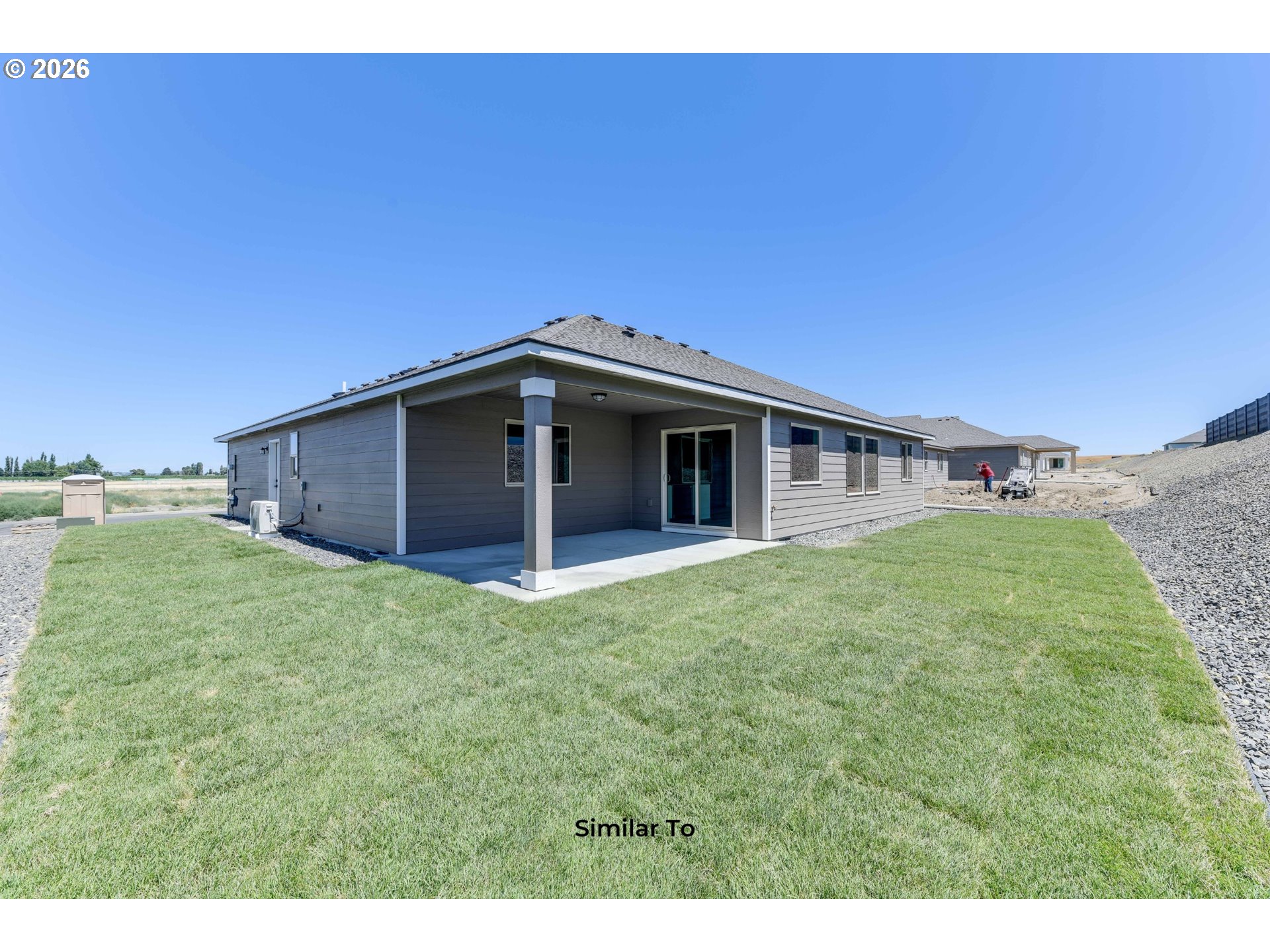 227 Southwest Goldfinch Lane Boardman, OR 97818 - Photo 22 of 28 a house view with a garden space