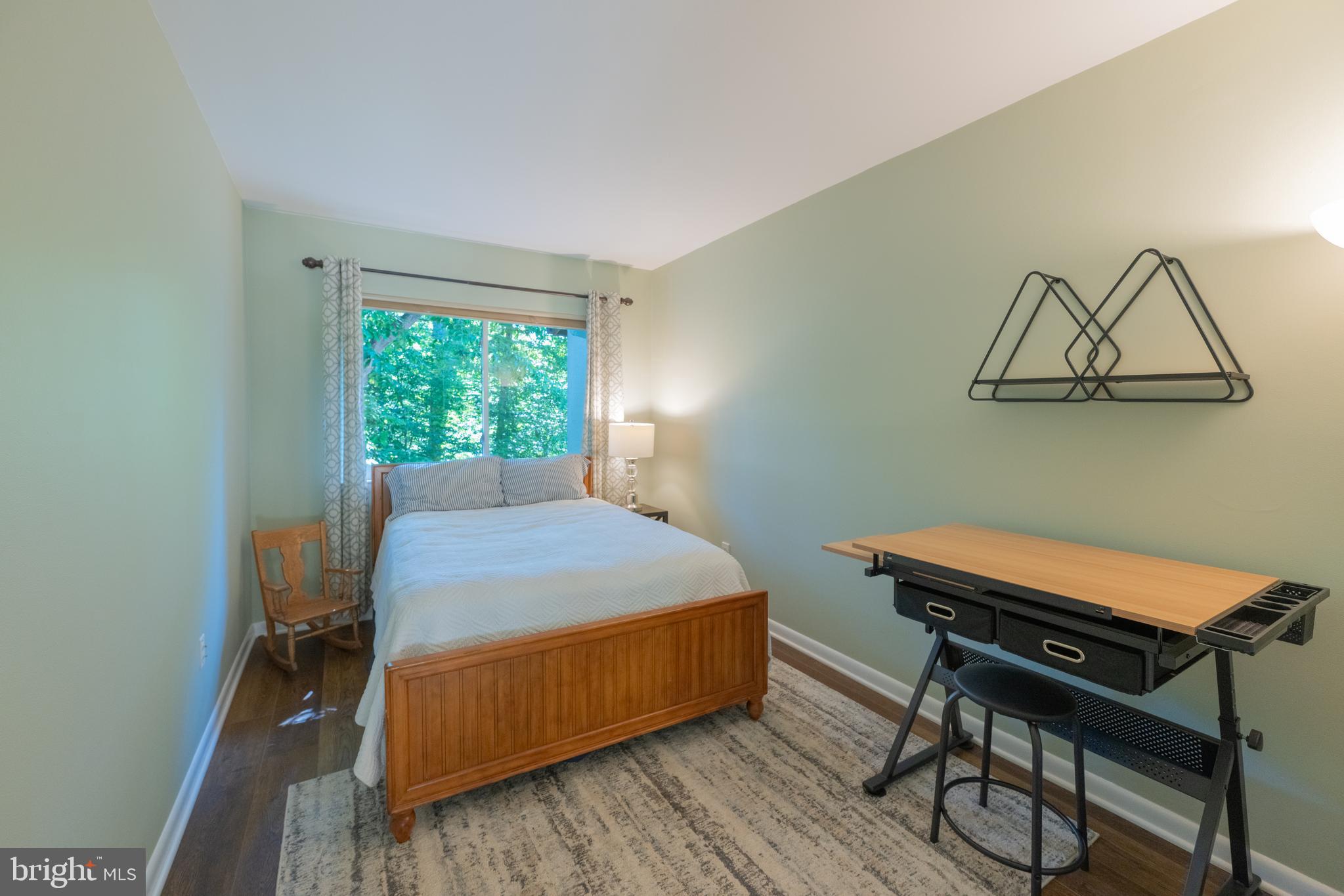 11917 Barrel Cooper Court Reston, VA 20191 - Photo 34 of 59 a bedroom with a bed and a table