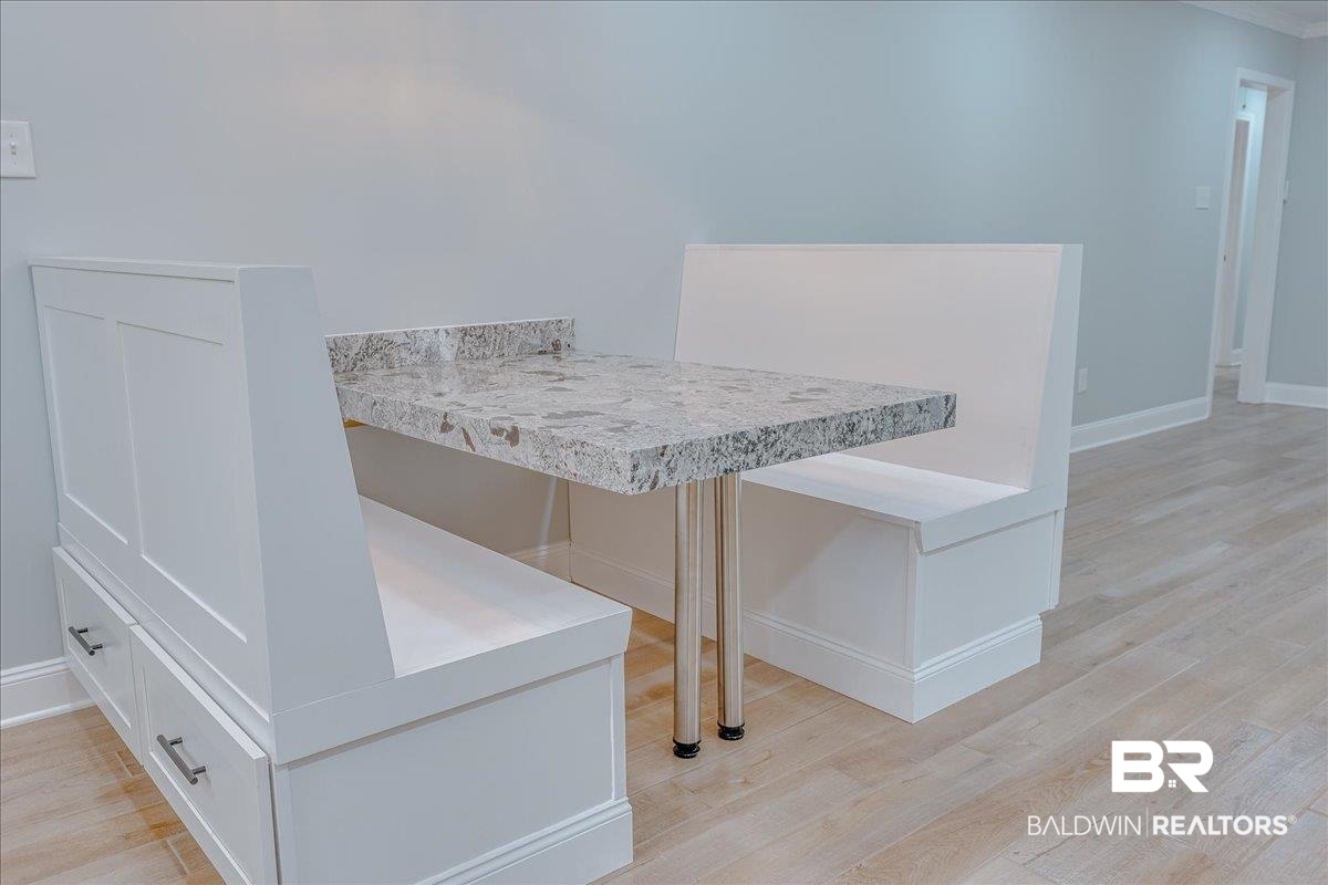 440 Dykes Road Mobile, AL 36608 - Photo 16 of 49 Dining area featuring breakfast area, baseboards, and light wood-style flooring