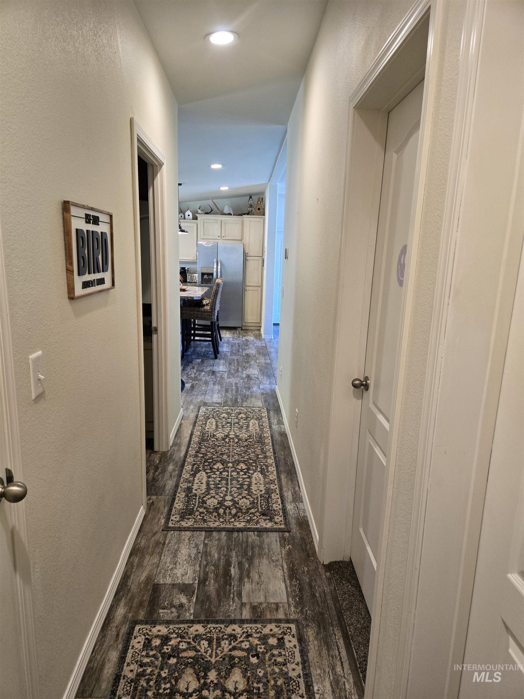 174 Konkolville Road Orofino, ID 83544 - Photo 21 of 43 Hallway featuring wood-finish flooring, white walls, and recessed lighting