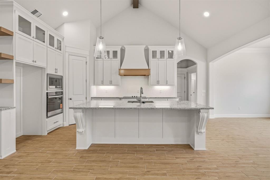 2017 Forest Bridge Azle, TX 76020 - Photo 12 of 30 a kitchen with stainless steel appliances granite countertop a sink a stove and a refrigerator