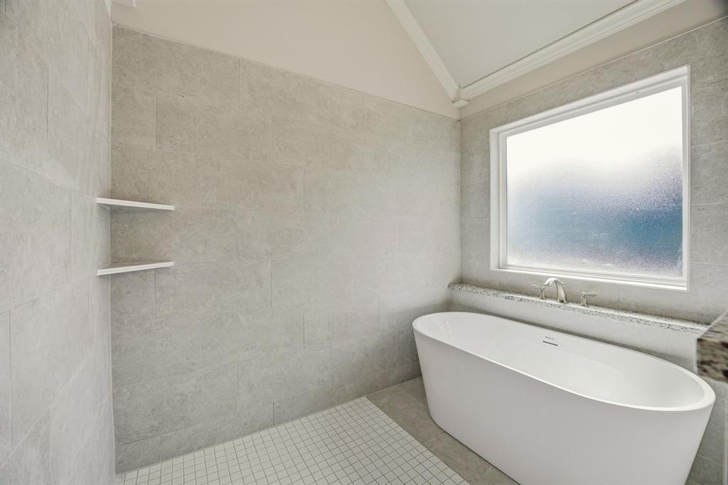 2017 Forest Bridge Azle, TX 76020 - Photo 19 of 30 a bathroom with a bathtub and window