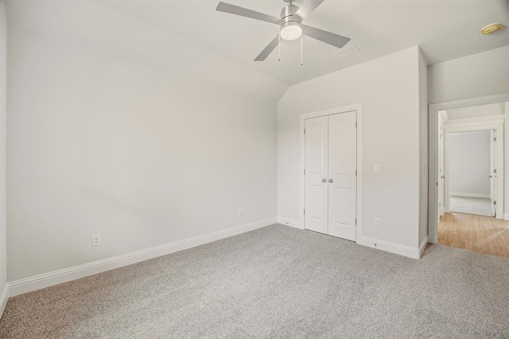 2017 Forest Bridge Azle, TX 76020 - Photo 27 of 30 an empty room with a ceiling fan and a window