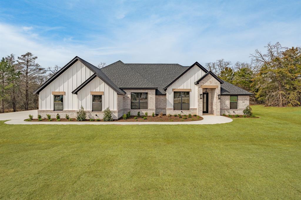 2017 Forest Bridge Azle, TX 76020 - Photo 3 of 30 a front view of house with yard and green space