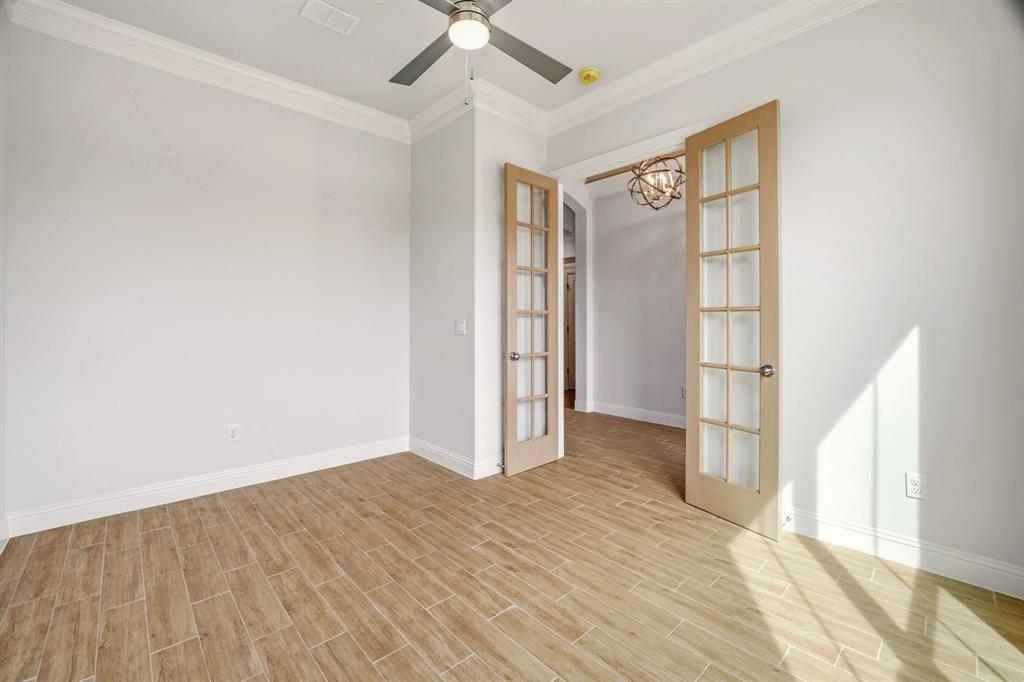 2017 Forest Bridge Azle, TX 76020 - Photo 7 of 30 an empty room with wooden floor and windows