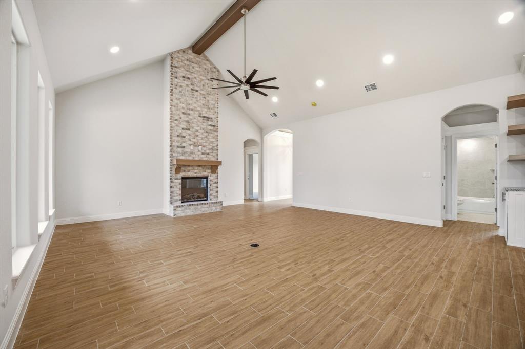 2017 Forest Bridge Azle, TX 76020 - Photo 10 of 30 wooden floor in an empty room with a fireplace