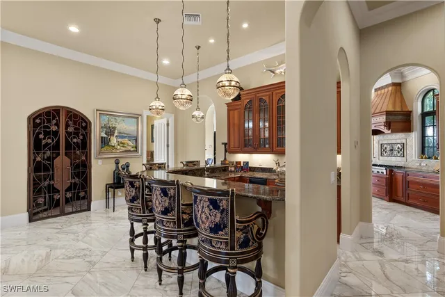 a kitchen with a table and chairs in it