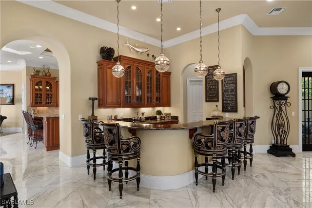 a kitchen with stainless steel appliances granite countertop a stove and a sink