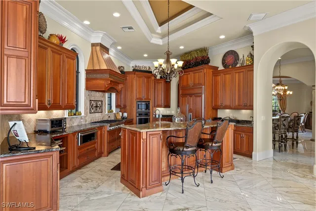 a view of living room kitchen and entryway