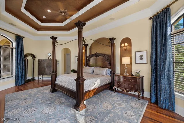 a bathroom with a granite countertop double vanity sink and a large mirror