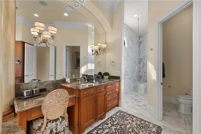 a living room with furniture and floor to ceiling windows