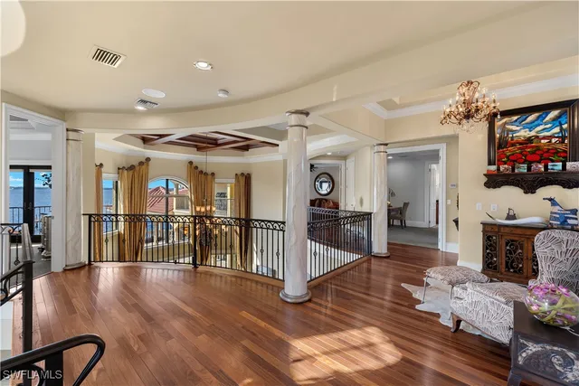 a view of hallway with wooden floor