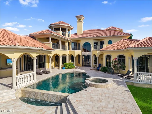 a view of a lake with a house in the background