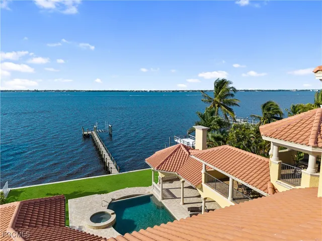 a front view of a house with outdoor seating