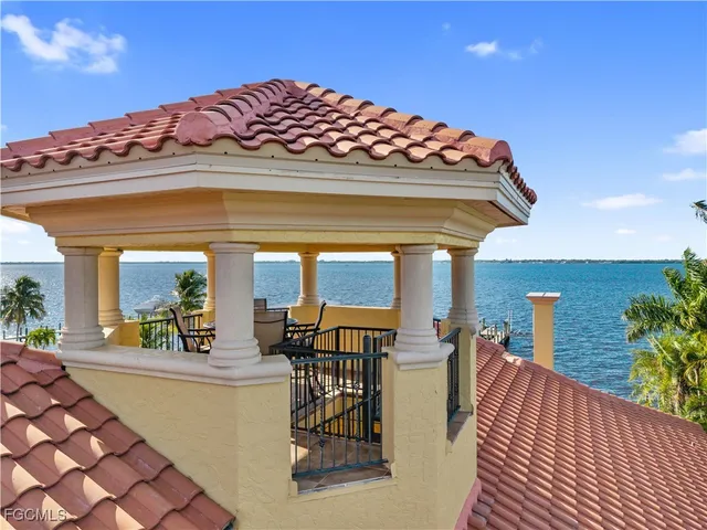 a front view of a house with a yard table and chairs