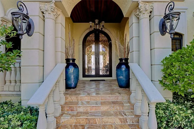 a vase of flowers sitting in a bathroom