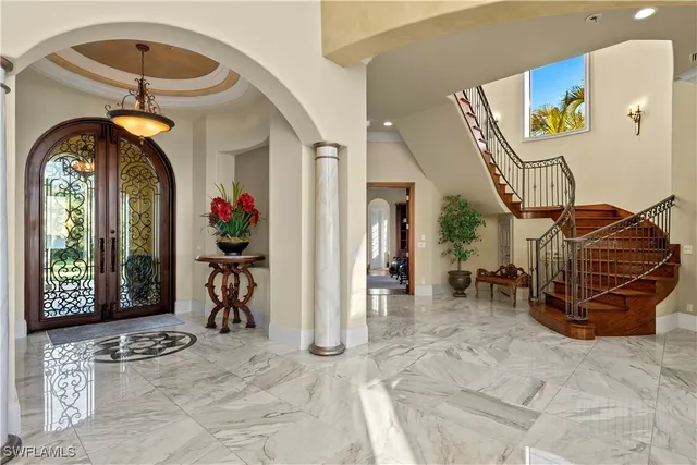 a view of living room with furniture and chandelier