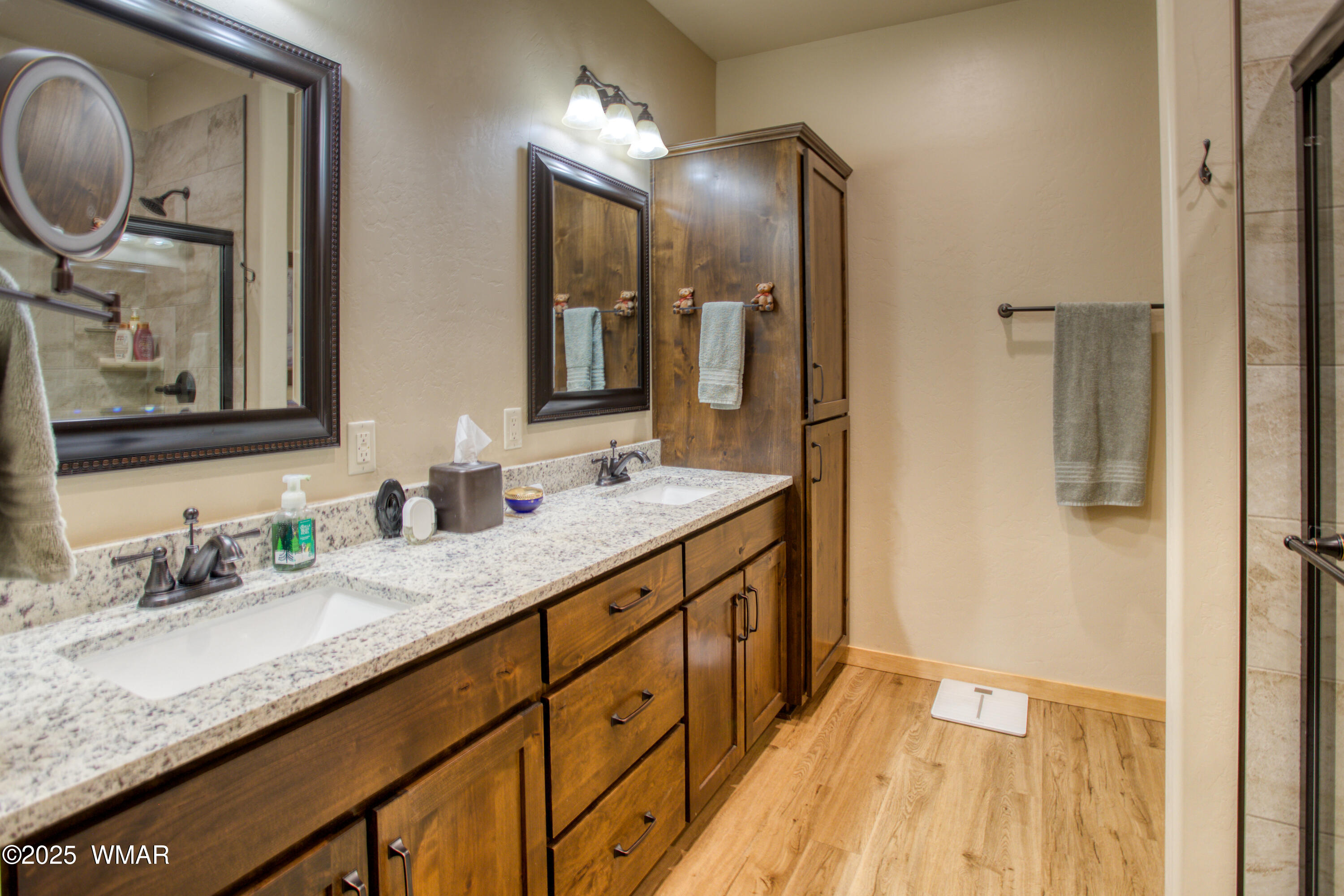 5863 Apollo Way Lakeside, AZ 85929 - Photo 9 of 16 a bathroom with double vanity sink and a mirror