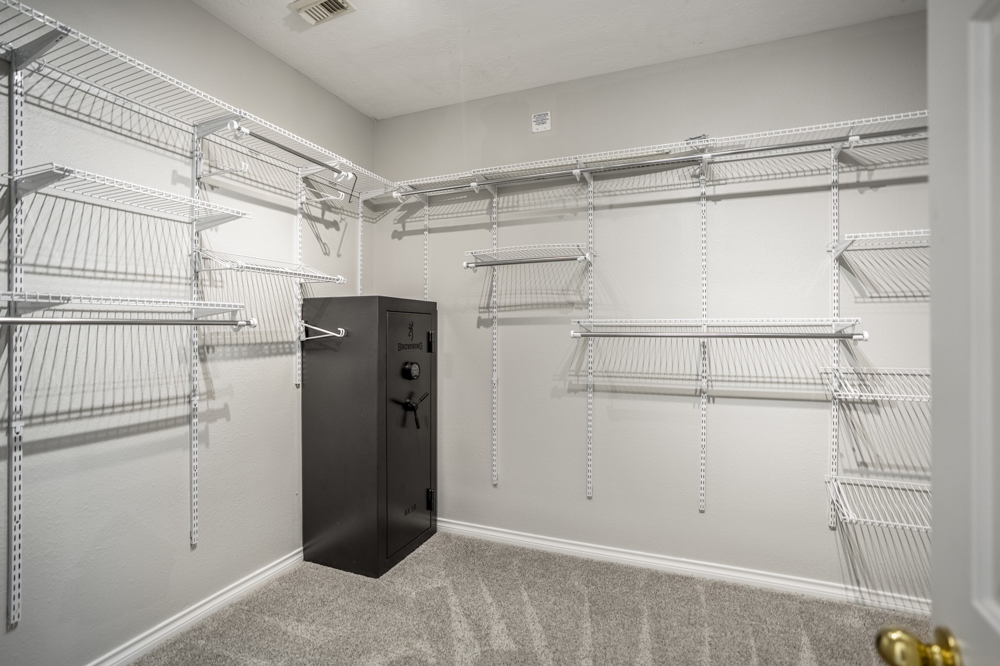 6311 Sparrows Glen Lane Spring, TX 77379 - Photo 21 of 50 Continuing past the renovated bath, the primary closet adds real storage depth with wraparound shelving, double hanging space, and multiple sections to keep clothing, shoes, and accessories easy to organize.