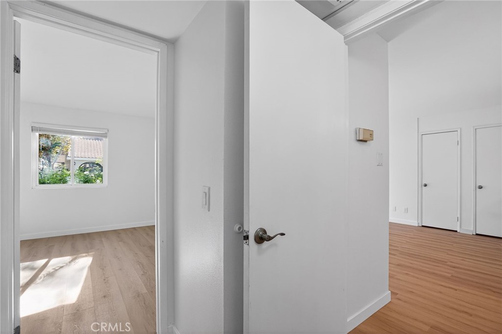 18808 Mandan Street, Unit 309 Canyon Country, CA 91351 - Photo 13 of 19 a view of a hallway with wooden floor