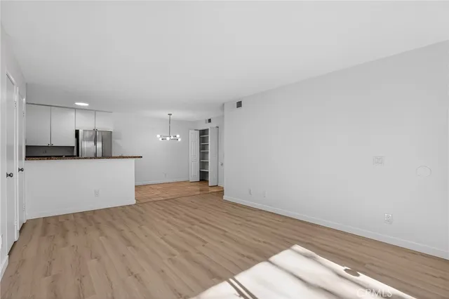 a view of kitchen with wooden floor