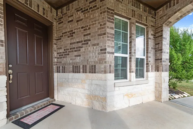 a view of entryway and hall with a front door